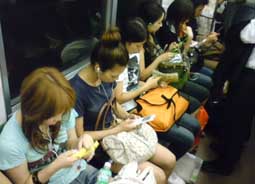 people texting in train
